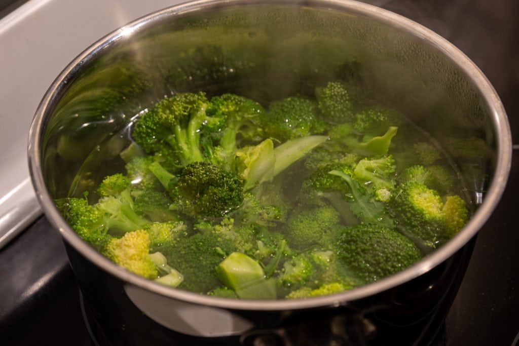 boiling broccoli florets until tender