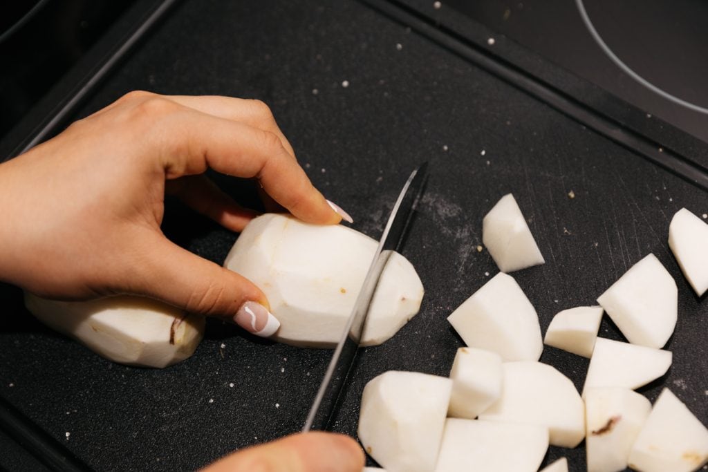 peeling turnips into cubes