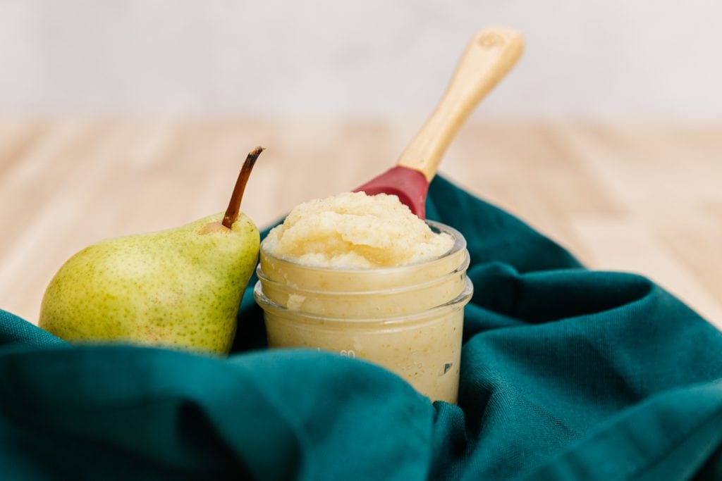 pear puree baby food on a table cloth