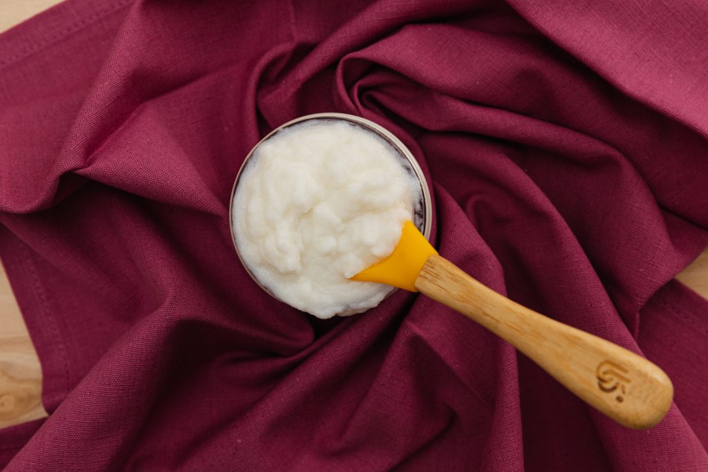 pureed turnips baby food with spoon on table cloth